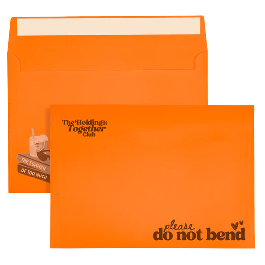 holding it together club orange envelope